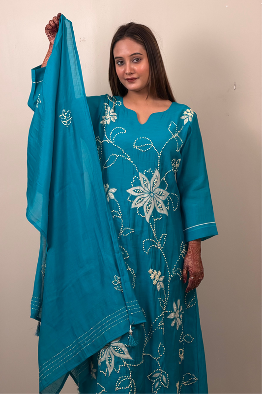 Woman holding a blue embroidered dupatta against a plain background
