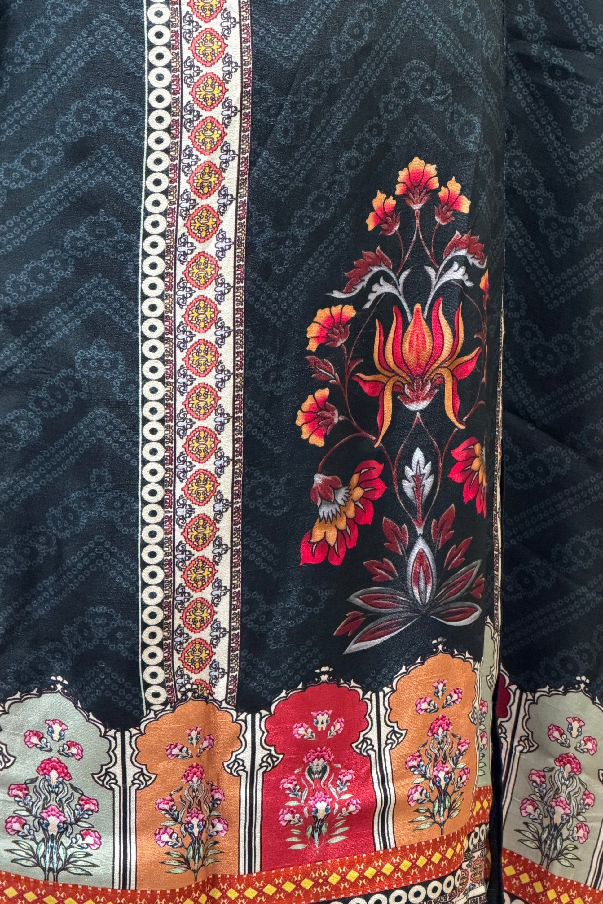Embroidered fabric with floral patterns on a dark background