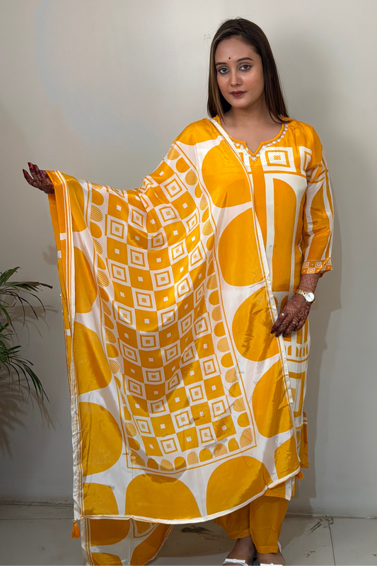 Woman wearing a yellow and white patterned dress against a plain background